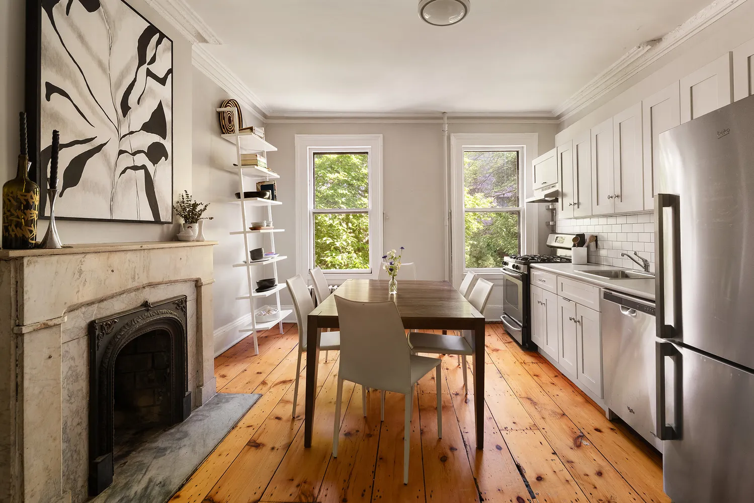 a bedroom with a bed a chair and next to a window