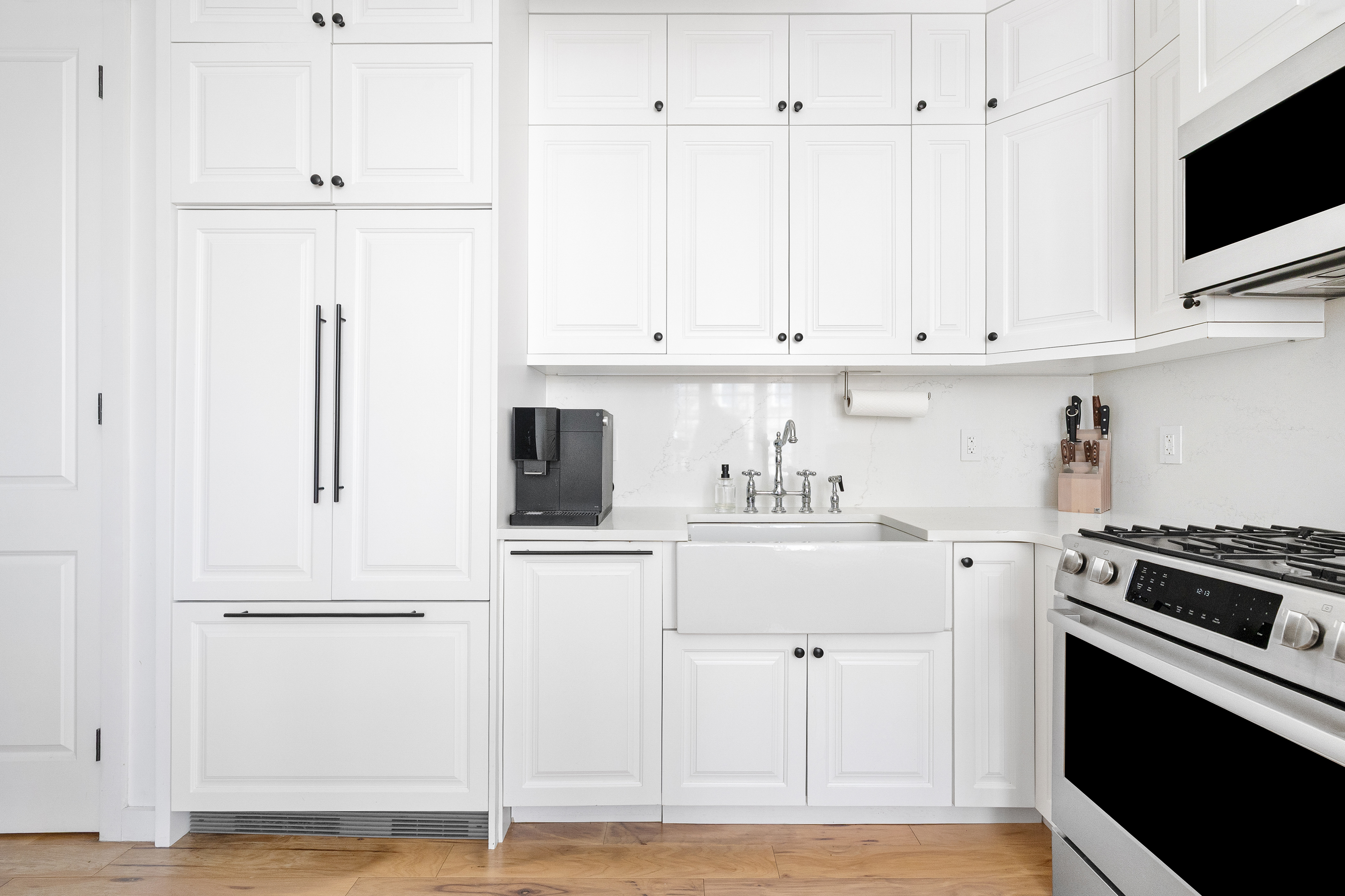 278 Nassau Avenue, Unit 2B Brooklyn, NY 11222 - Photo 2 of 18 a kitchen with white cabinets and white appliances