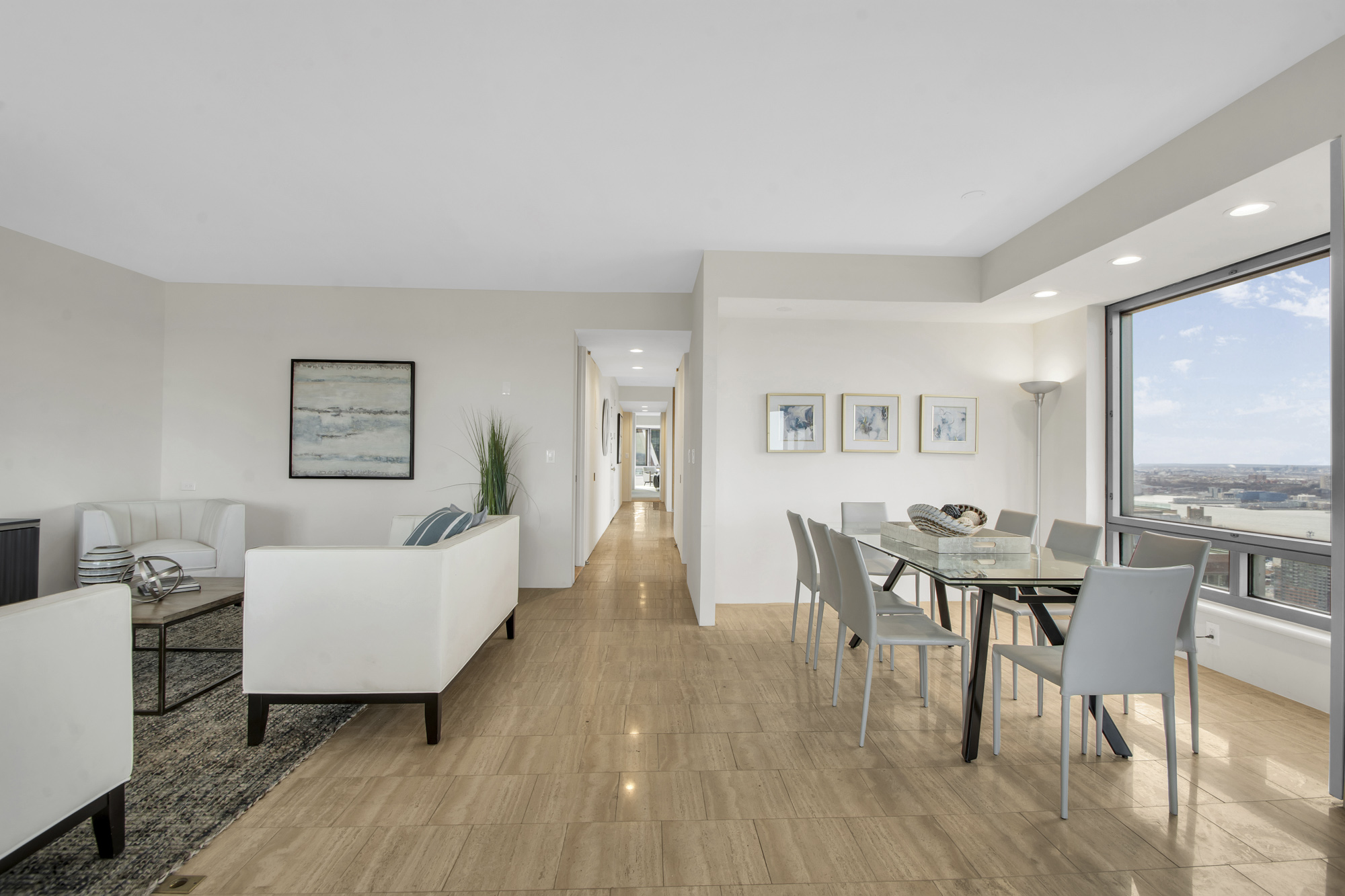 301 West 57th Street, Unit 48A Manhattan, NY 10019 - Photo 7 of 22 a living room with furniture and wooden floor