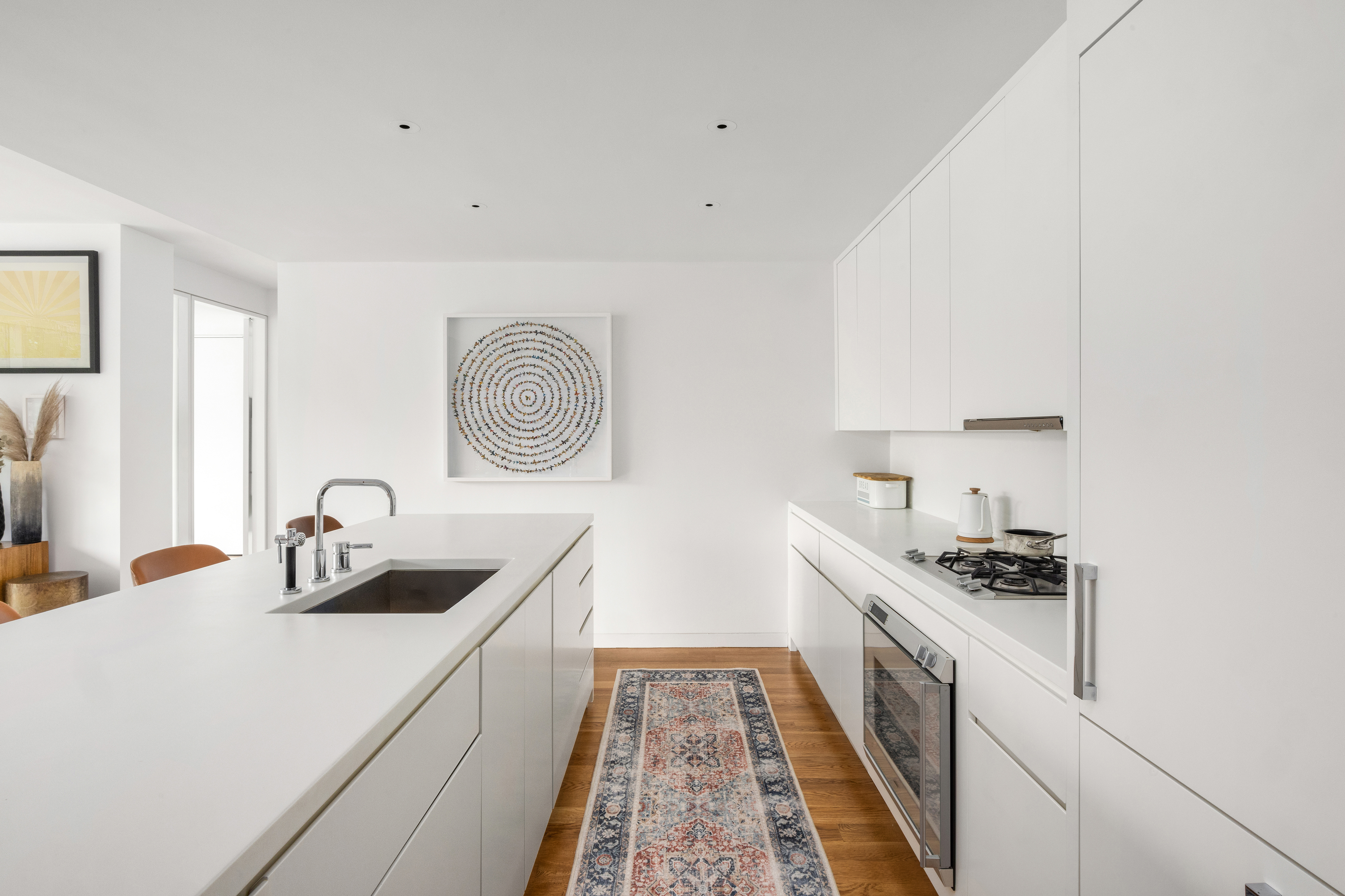 1 Grand Army Plaza, Unit 3C Brooklyn, NY 11238 - Photo 5 of 23 a kitchen with granite countertop a sink and cabinets