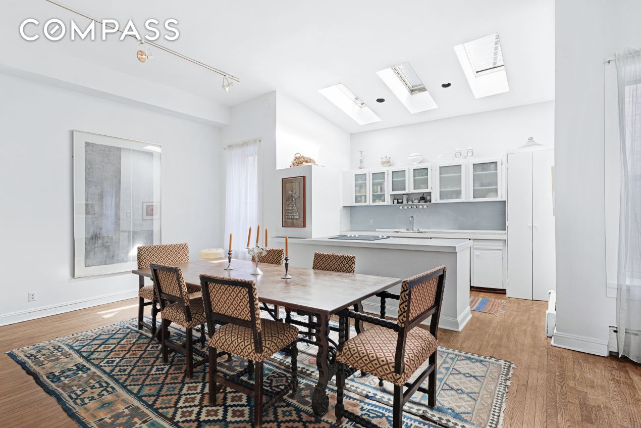 6 Centre Market Place, Unit 3 Manhattan, NY 10013 - Photo 2 of 9 a view of a dining room with furniture and wooden floor