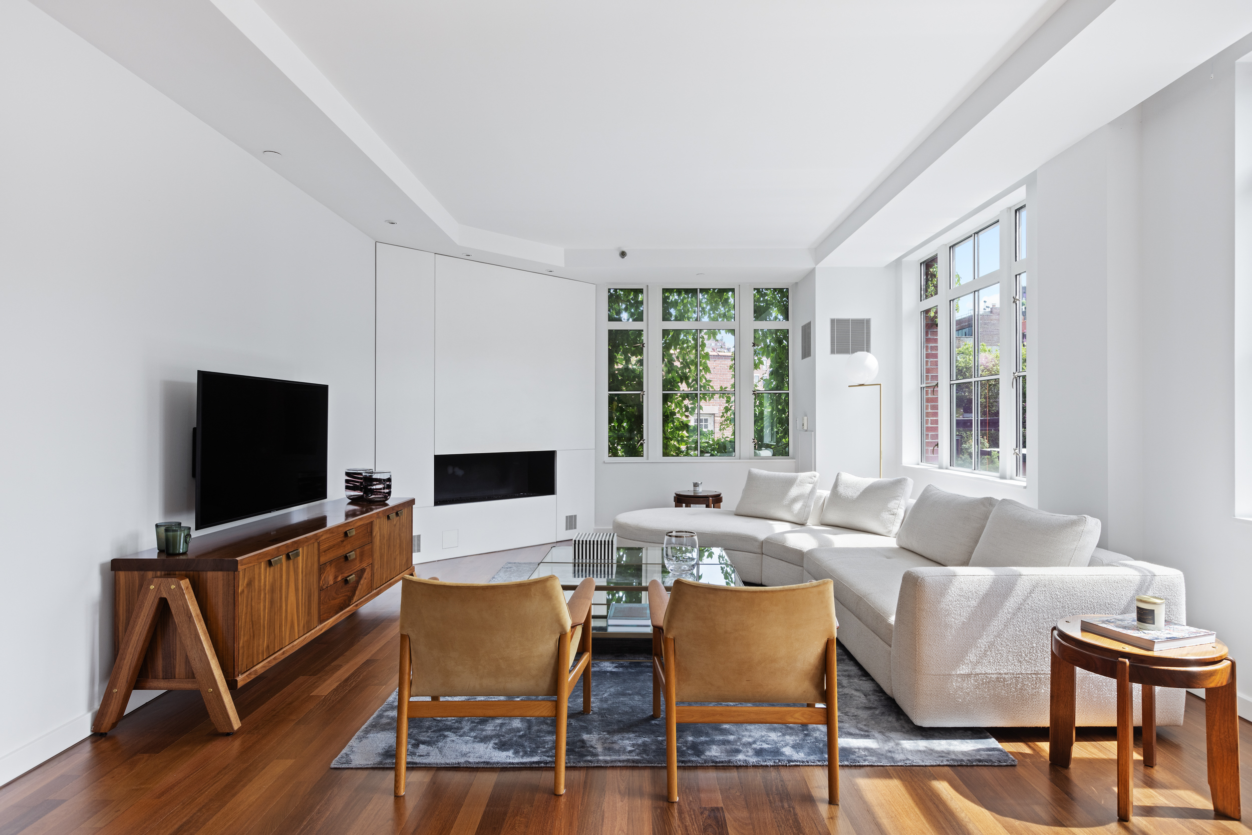 744 Greenwich Street, Unit 4 Manhattan, NY 10014 - Photo 5 of 34 a living room with furniture and a flat screen tv