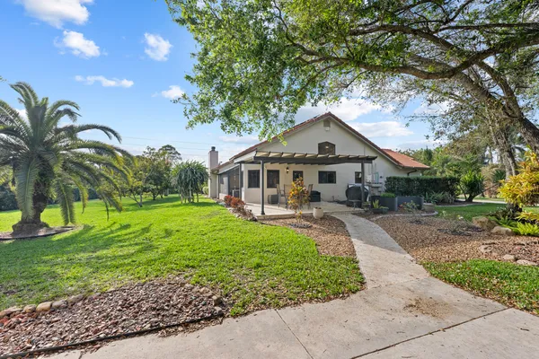 aerial view of a house with a yard