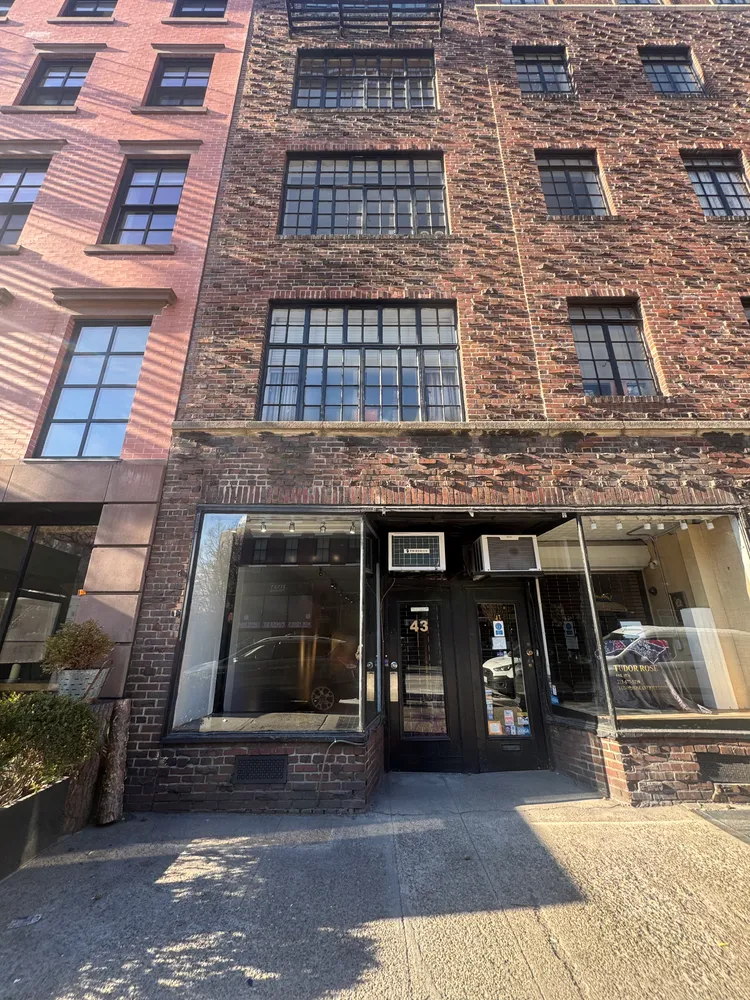 a front view of a building with glass windows