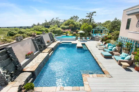 a view of swimming pool with lounge chair