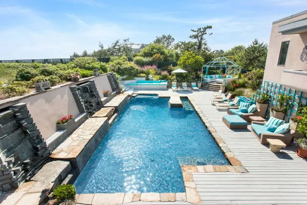 a view of swimming pool with lounge chair