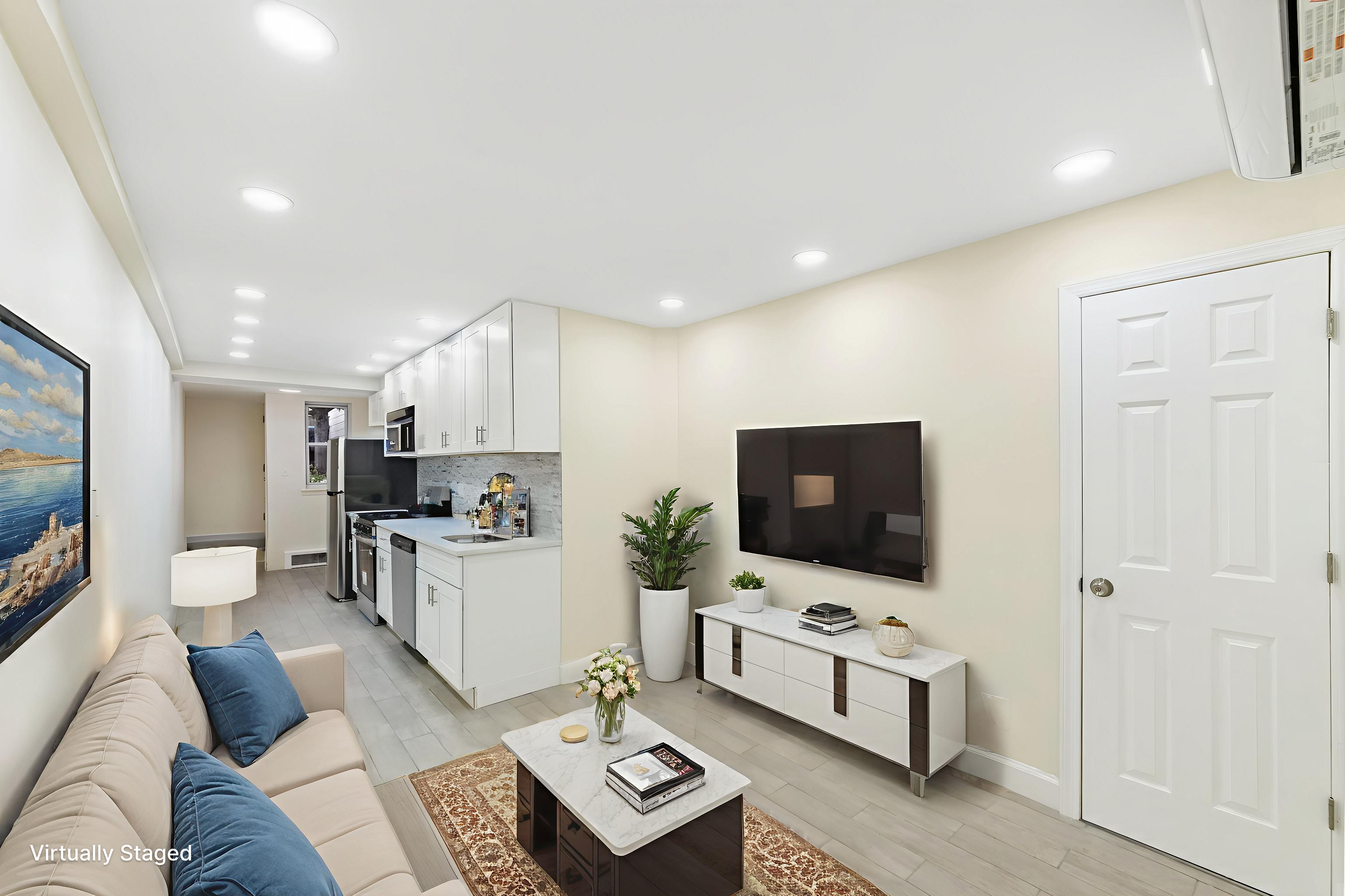 185 Oxford Street Brooklyn, NY 11235 - Photo 5 of 17 a living room with furniture and a flat screen tv