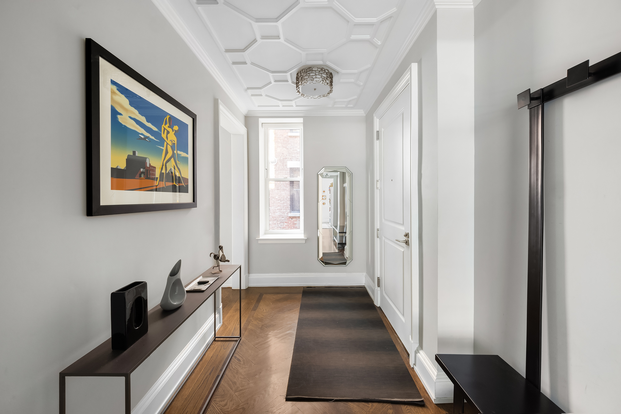 344 West 72nd Street, Unit 1007 Manhattan, NY 10023 - Photo 17 of 23 a hallway with front door and wooden floor