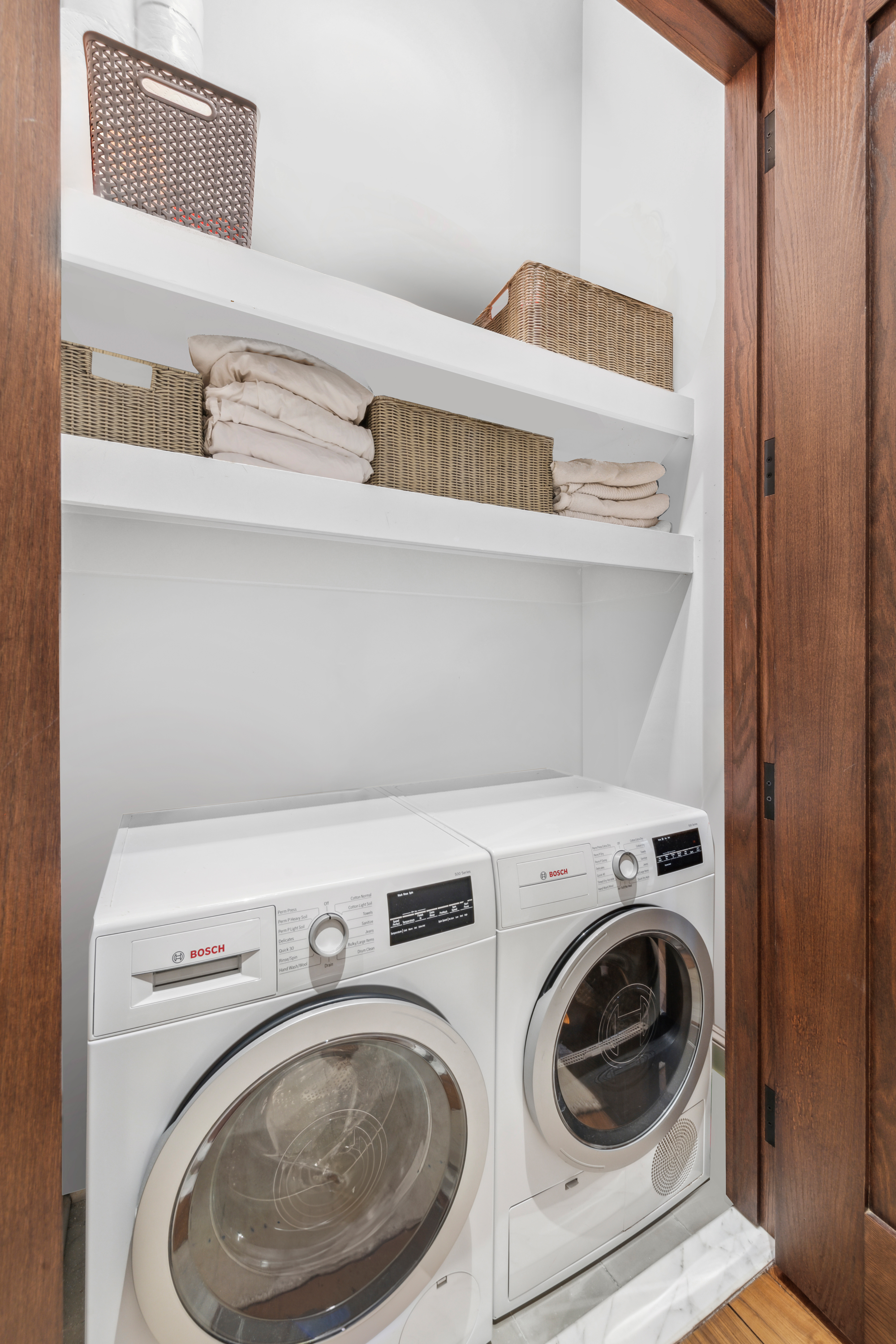 520 West 45th Street, Unit 4D Manhattan, NY 10036 - Photo 7 of 13 a utility room with dryer and washer