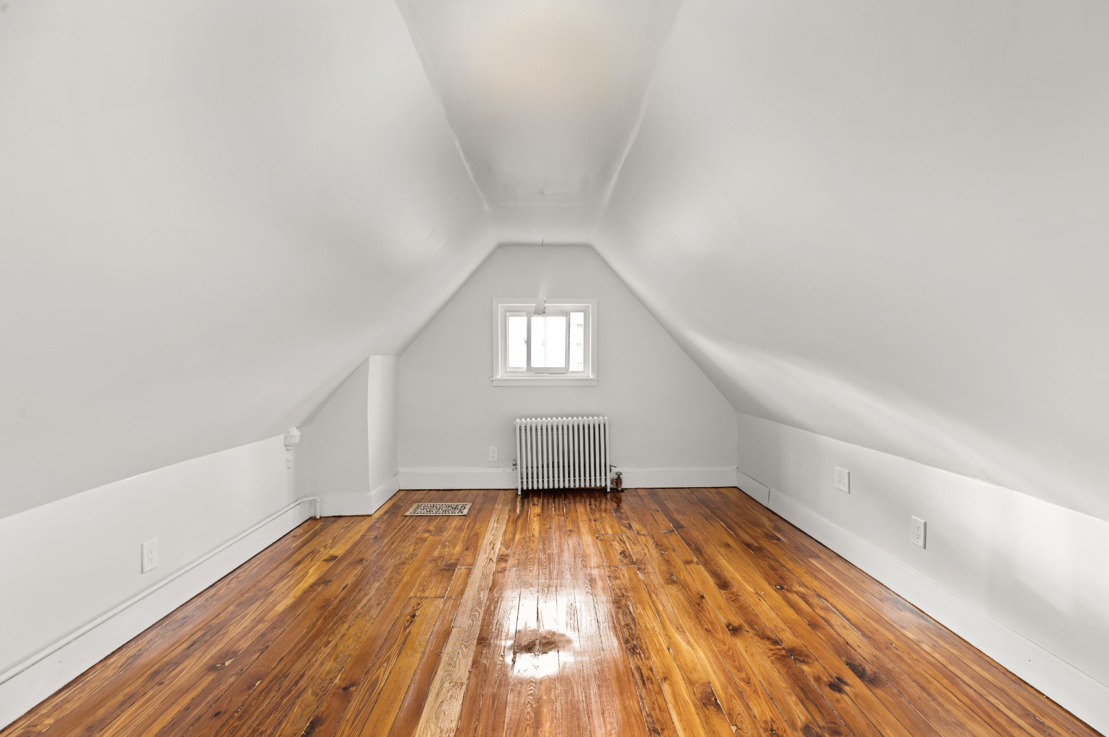 180 East 5th Street, Unit 2 Brooklyn, NY 11218 - Photo 9 of 14 a view of empty room with wooden floor and fan