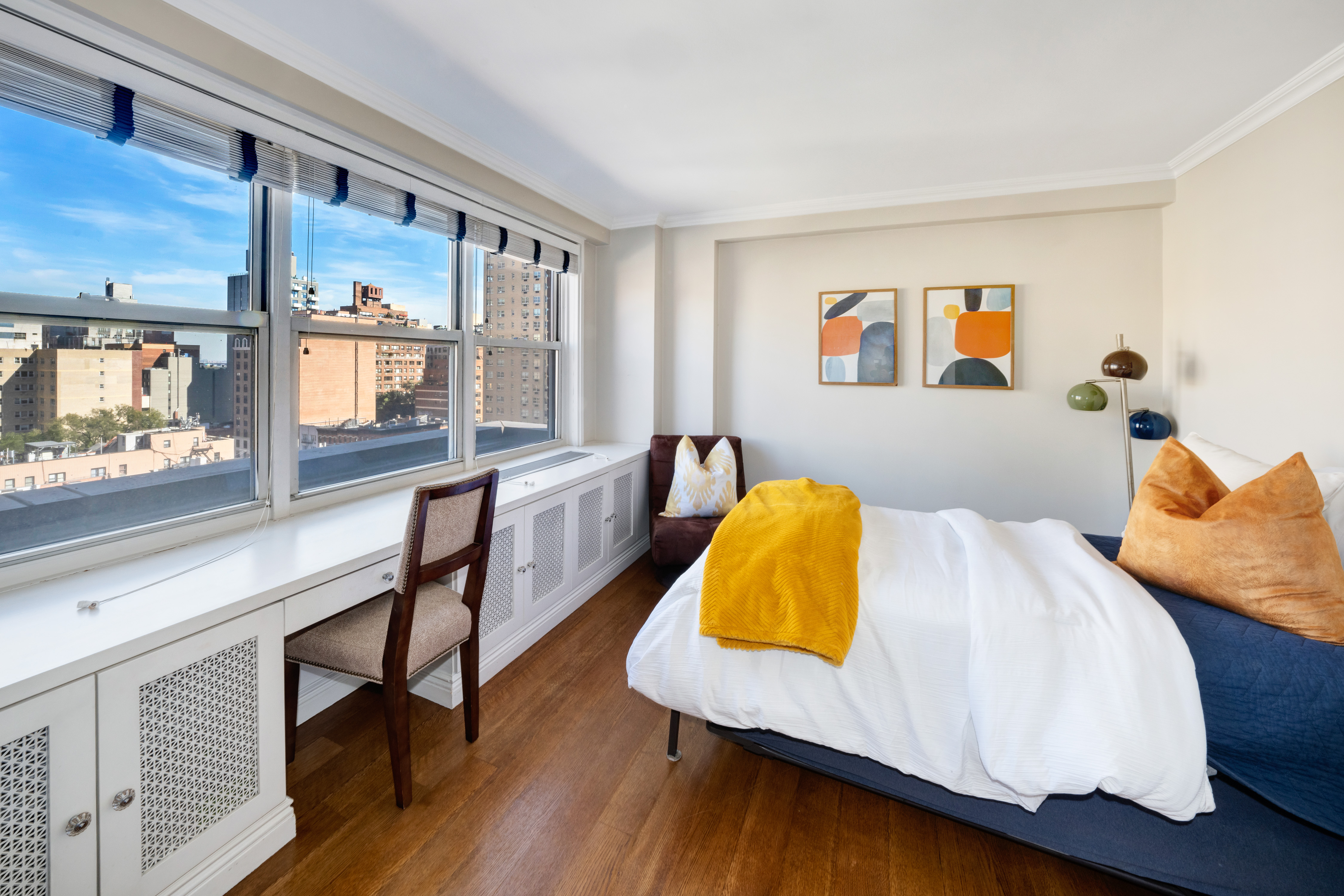 444 East 84th Street, Unit PHE Manhattan, NY 10028 - Photo 10 of 12 a bedroom with a bed and wooden floor