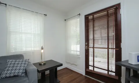 a room that has a window and a table in it