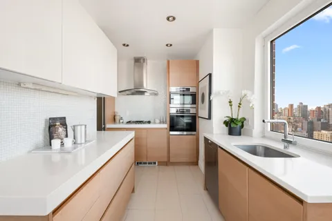 a kitchen with counter top space and sink