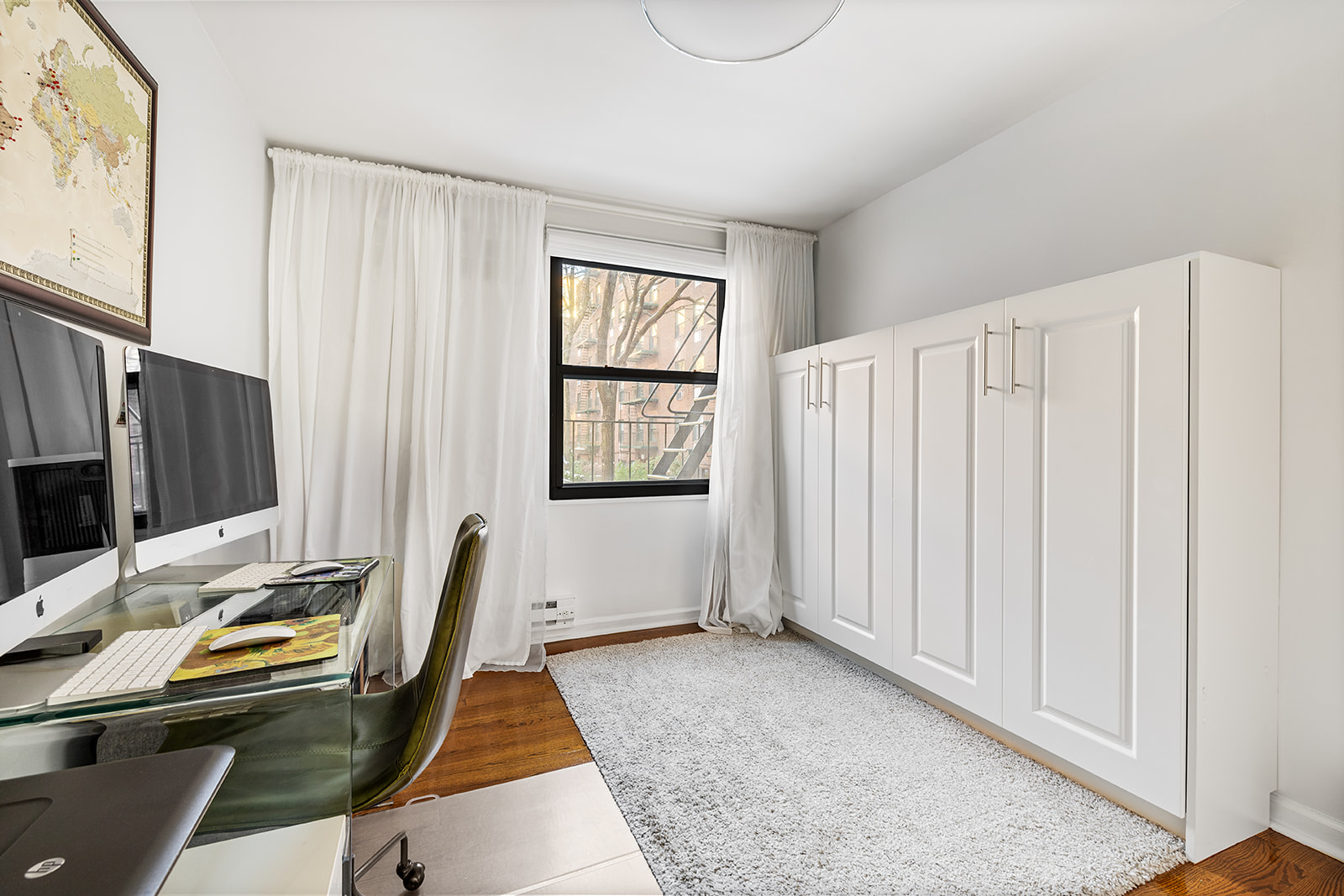 376 West Street, Unit 1A Manhattan, NY 10014 - Photo 6 of 11 a view of a workspace with furniture and a window