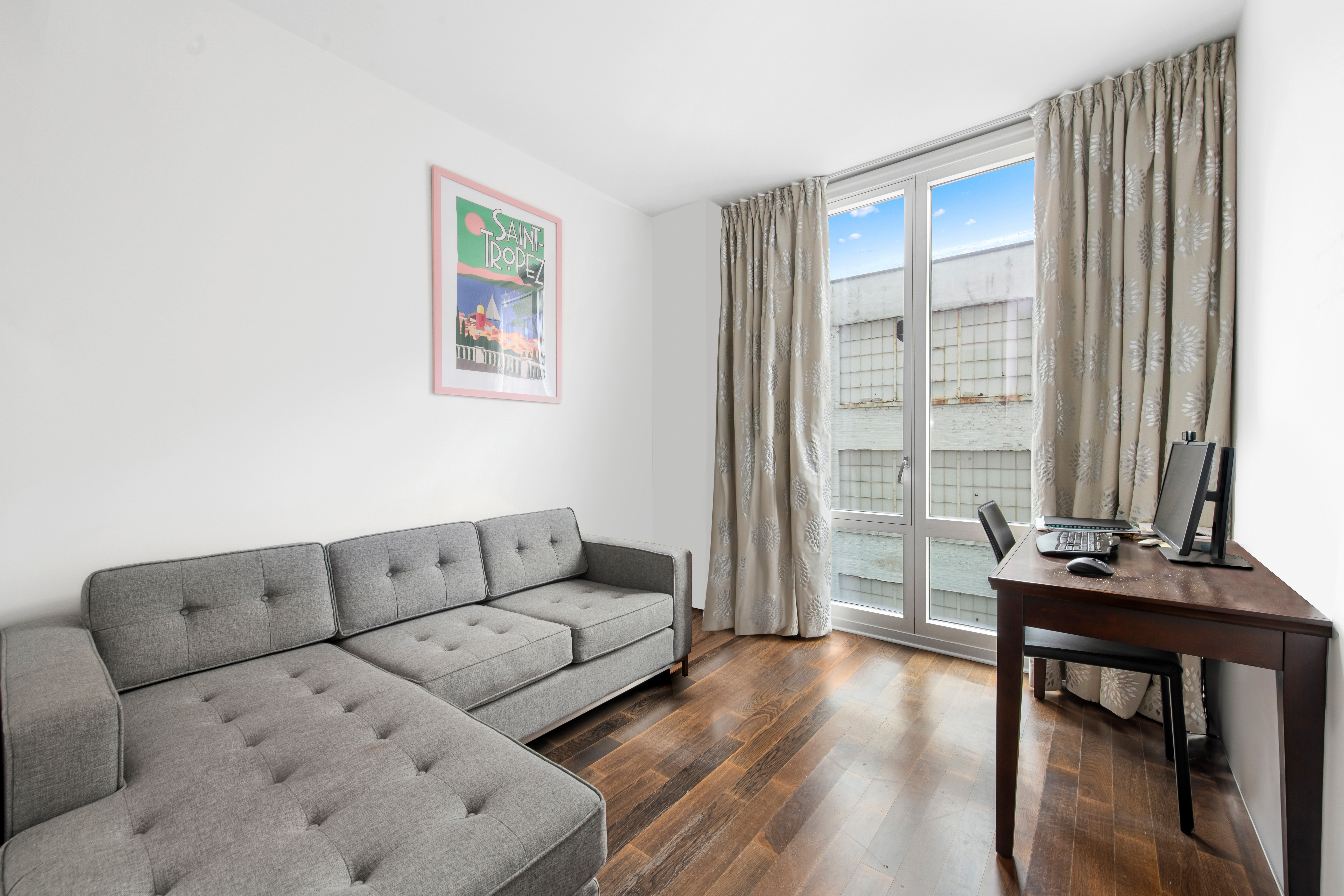 340 East 23rd Street, Unit 4D Manhattan, NY 10010 - Photo 8 of 19 a living room with furniture and a window