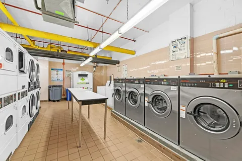 a view of a storage & utility room with washer and dryer