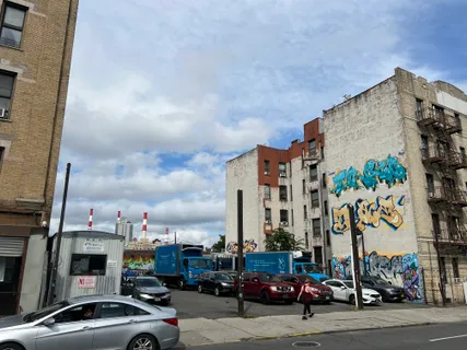 a view of a street with cars