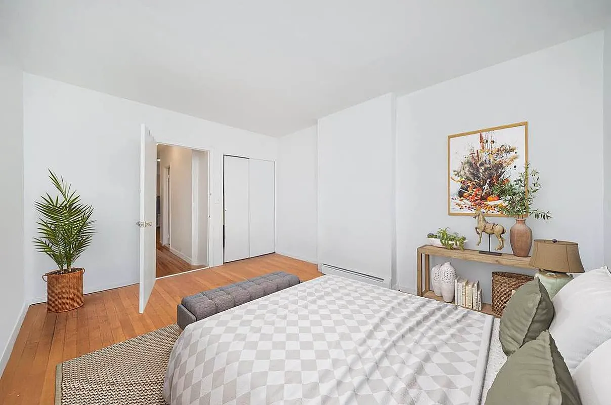 103 West 105th Street, Unit 2A Manhattan, NY 10025 - Photo 7 of 10 a bedroom that has a bed and a table in it
