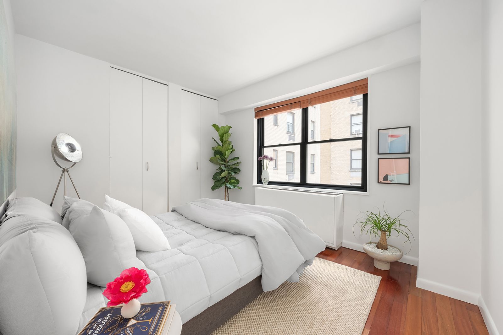 178 East 80th Street, Unit 7F Manhattan, NY 10075 - Photo 6 of 10 a bedroom with bed and a window