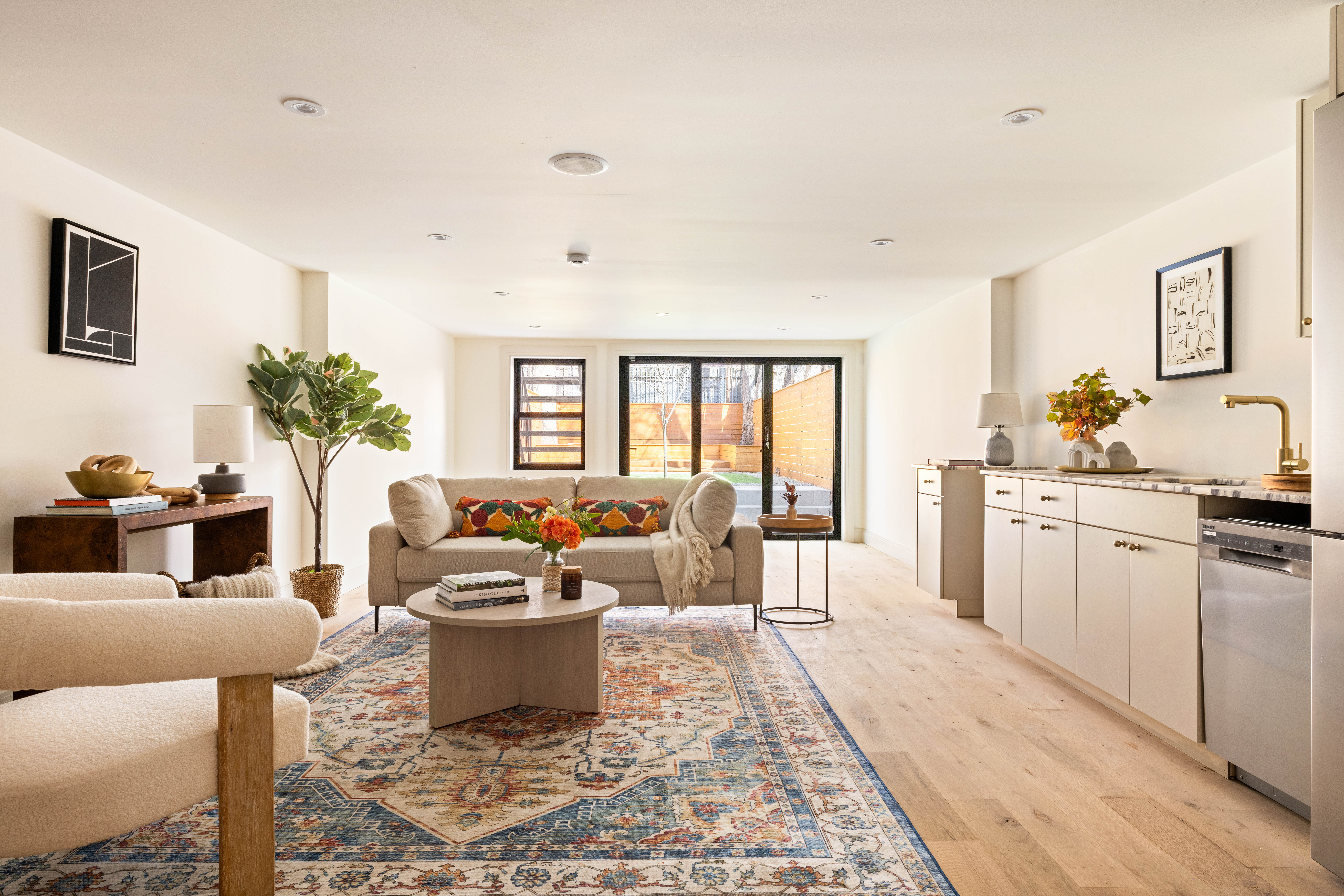 311 Monroe Street Brooklyn, NY 11216 - Photo 13 of 18 a living room with furniture and a potted plant