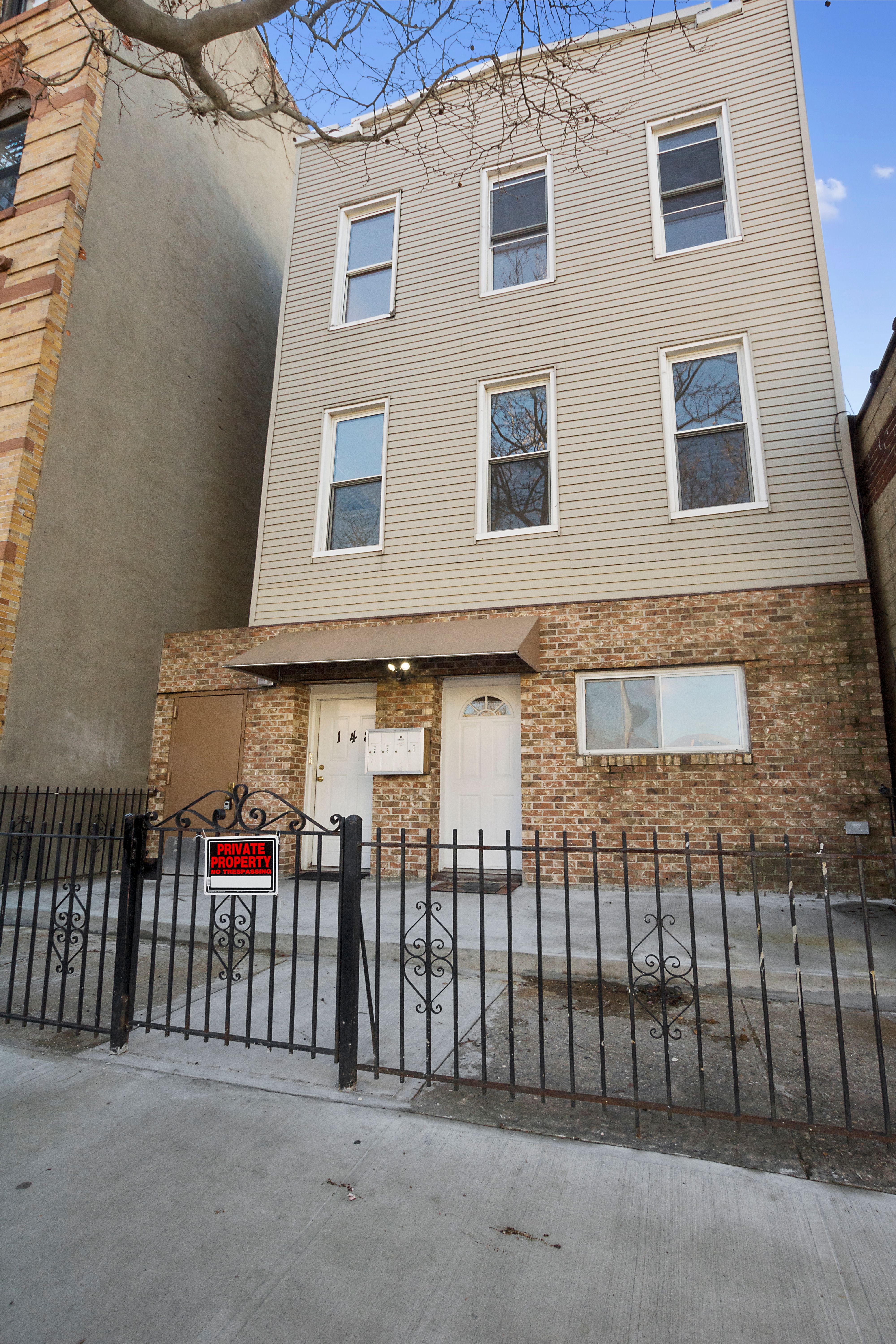 148 29th Street Brooklyn, NY 11232 - Photo 28 of 31 a view of a brick house with many windows