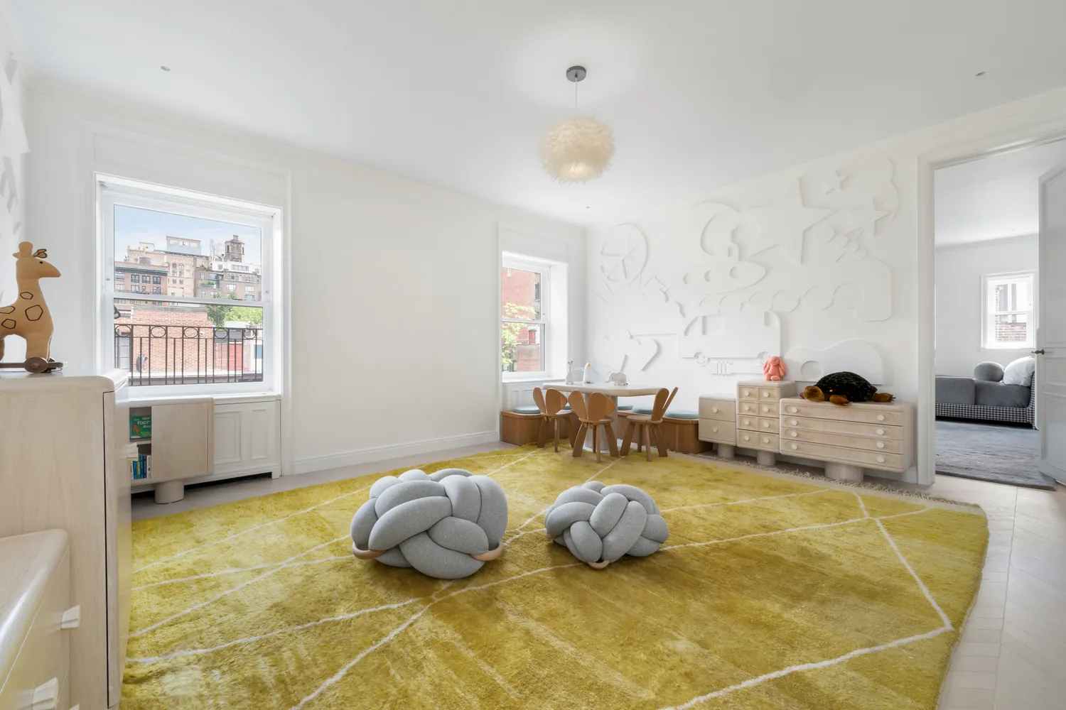 a bedroom with furniture and a window