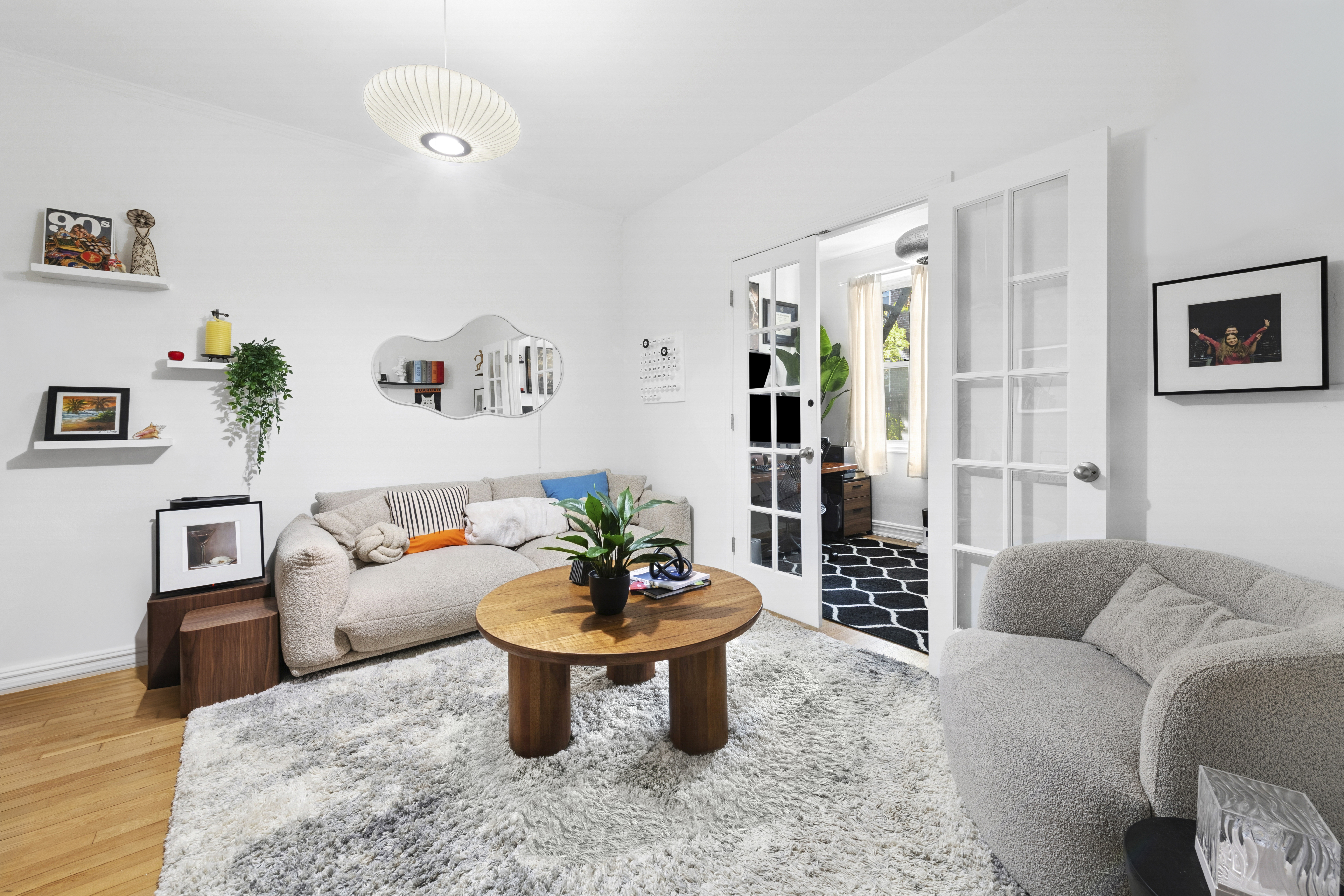 140 East 2nd Street, Unit 5F Brooklyn, NY 11218 - Photo 3 of 7 a living room with furniture and a potted plant