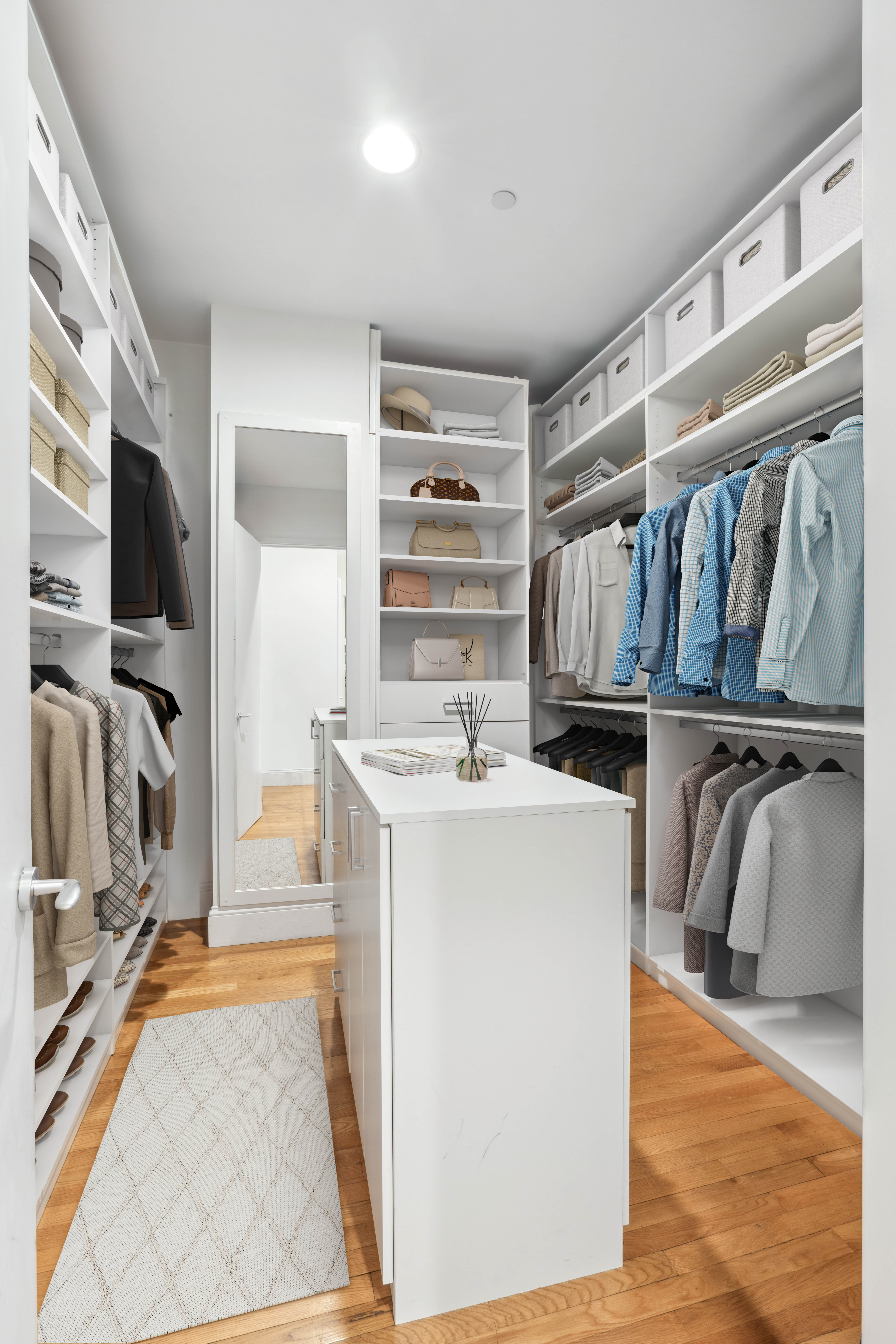 129 Lafayette Street, Unit 3B Manhattan, NY 10013 - Photo 10 of 13 a view of walk in closet with clothes and shoes