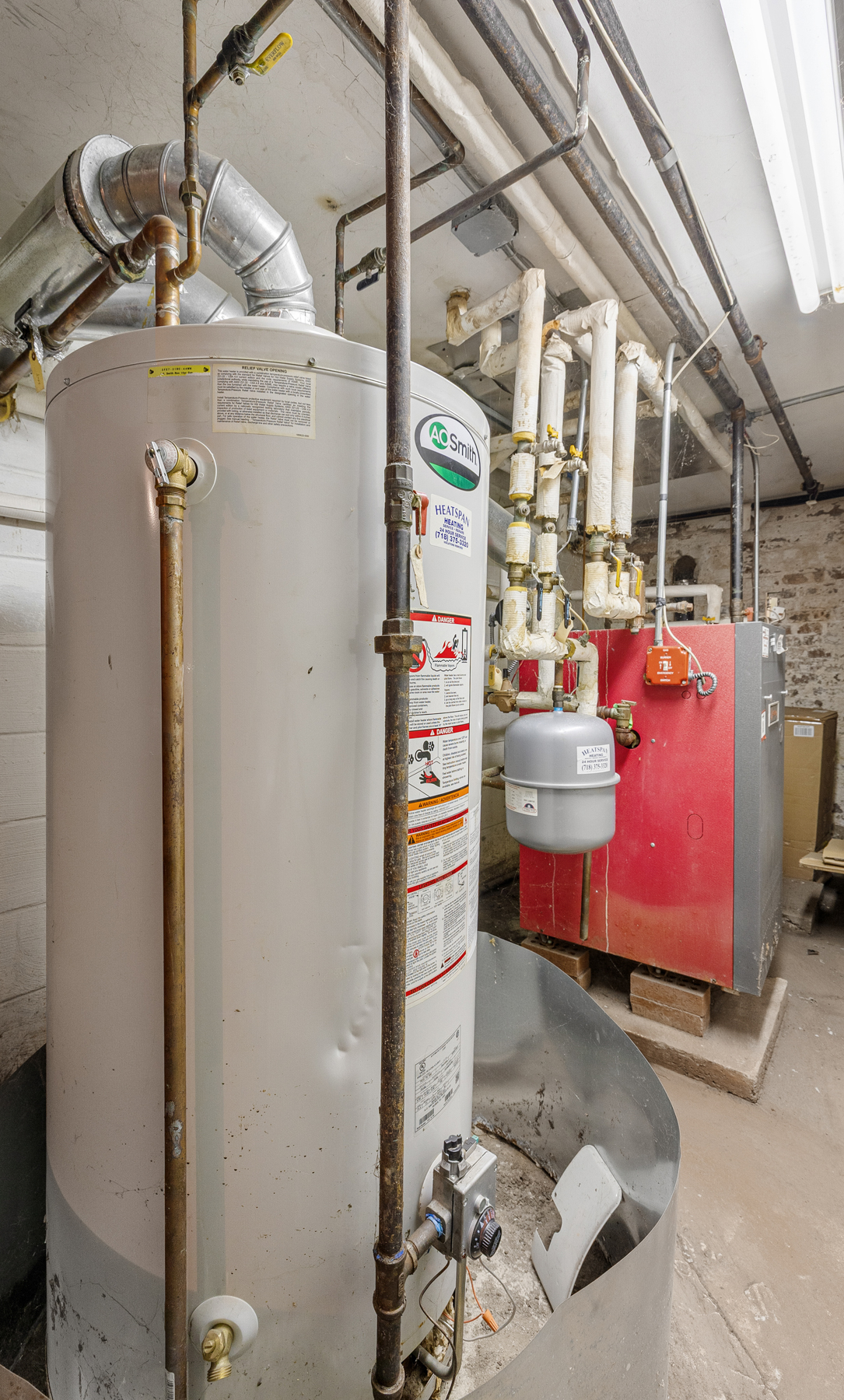 106 Crescent Street Brooklyn, NY 11208 - Photo 17 of 18 a room with storage and utility