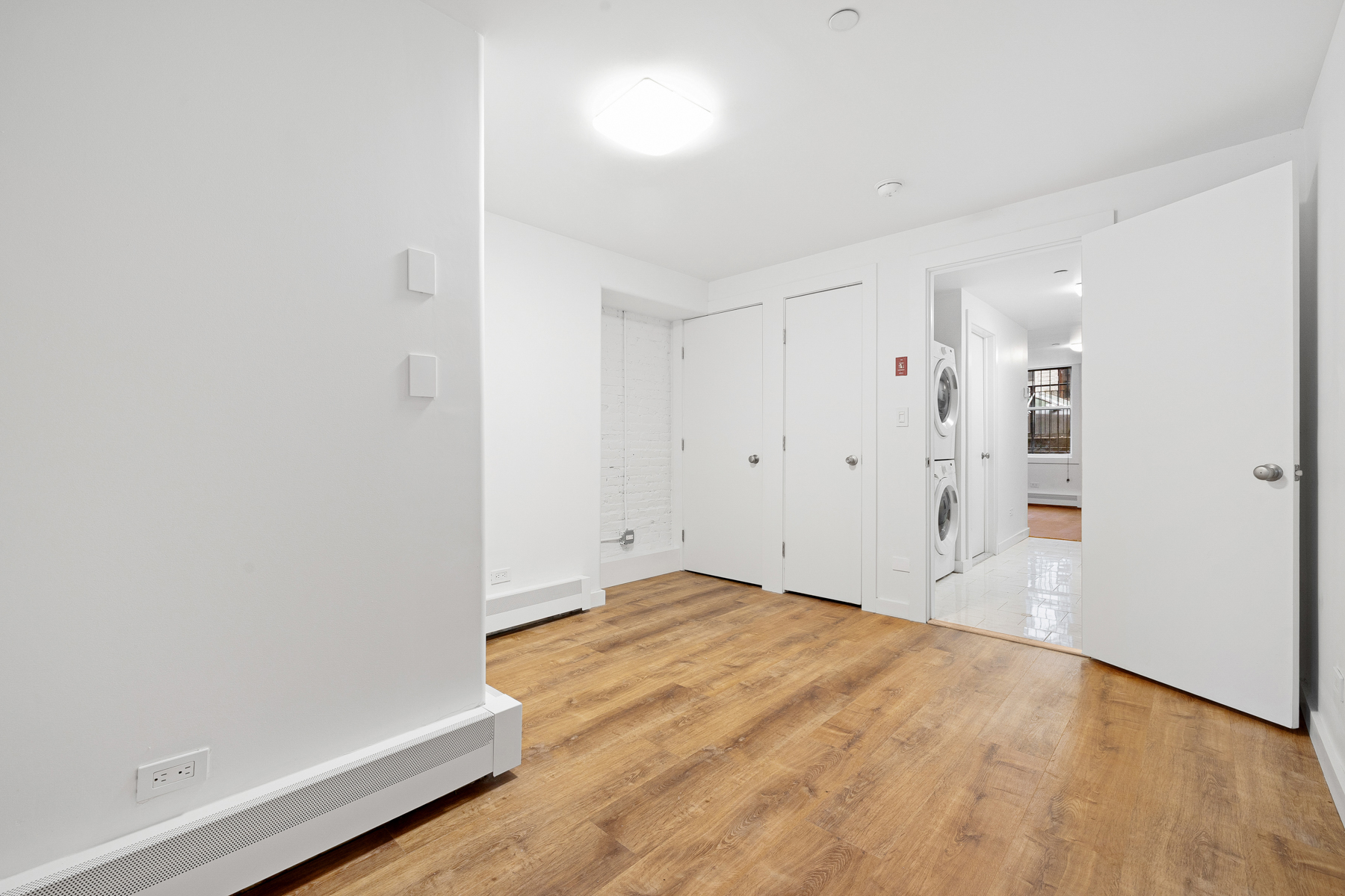 63 Putnam Avenue Brooklyn, NY 11238 - Photo 6 of 11 a view of empty room with wooden floor