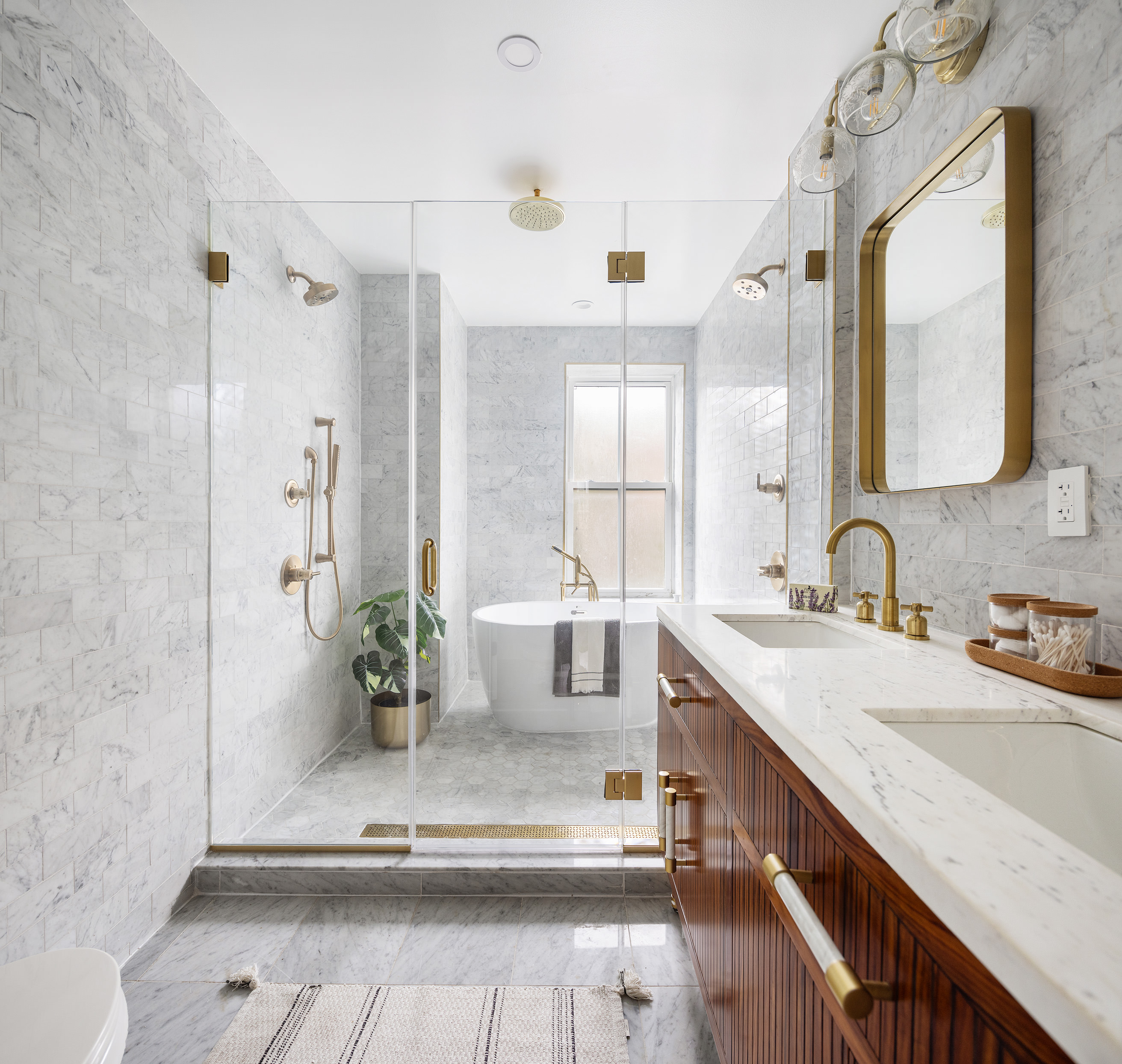 167 Putnam Avenue, Unit MF Brooklyn, NY 11216 - Photo 11 of 19 a bathroom with a double vanity sink a mirror and a shower