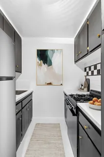 a kitchen with stainless steel appliances a stove and a refrigerator