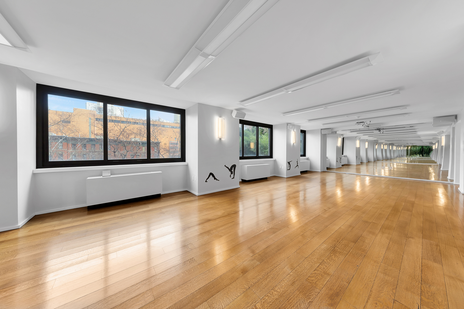 515 East 72nd Street, Unit 36B Manhattan, NY 10021 - Photo 32 of 36 a view of an empty room with a window and wooden floor