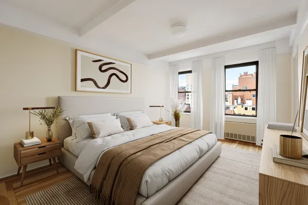 a bedroom with a bed and a view of kitchen