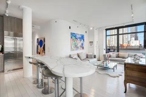 a large kitchen with a table and chairs
