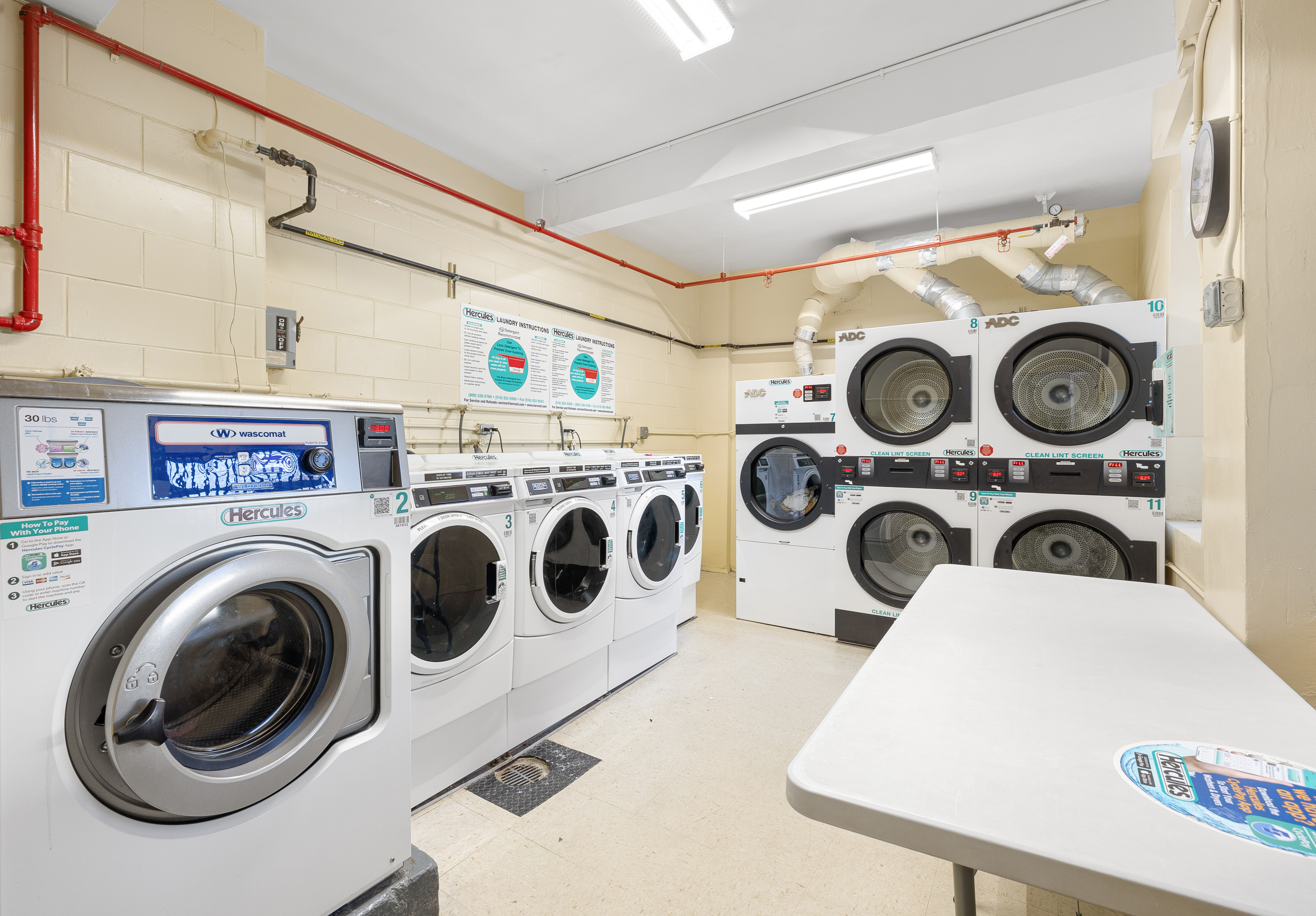 609 Kappock Street, Unit 5C Bronx, NY 10463 - Photo 15 of 18 a utility room with dryer and washer