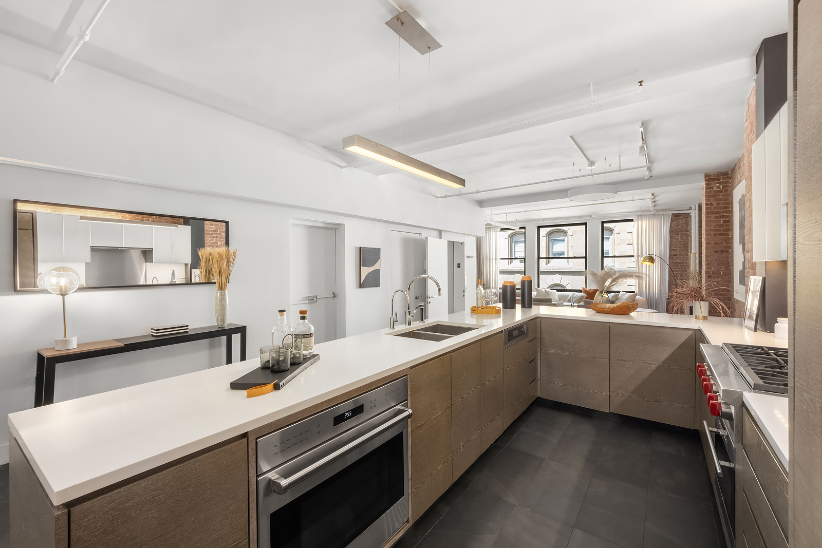36 West 15th Street, Unit 4 Manhattan, NY 10011 - Photo 7 of 21 a large white kitchen with a sink and dishwasher a stove with wooden floor