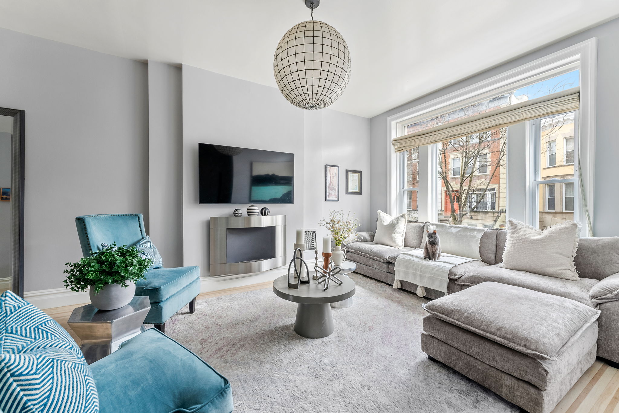 6 Virginia Place Brooklyn, NY 11213 - Photo 2 of 26 a living room with furniture a flat screen tv and a large window