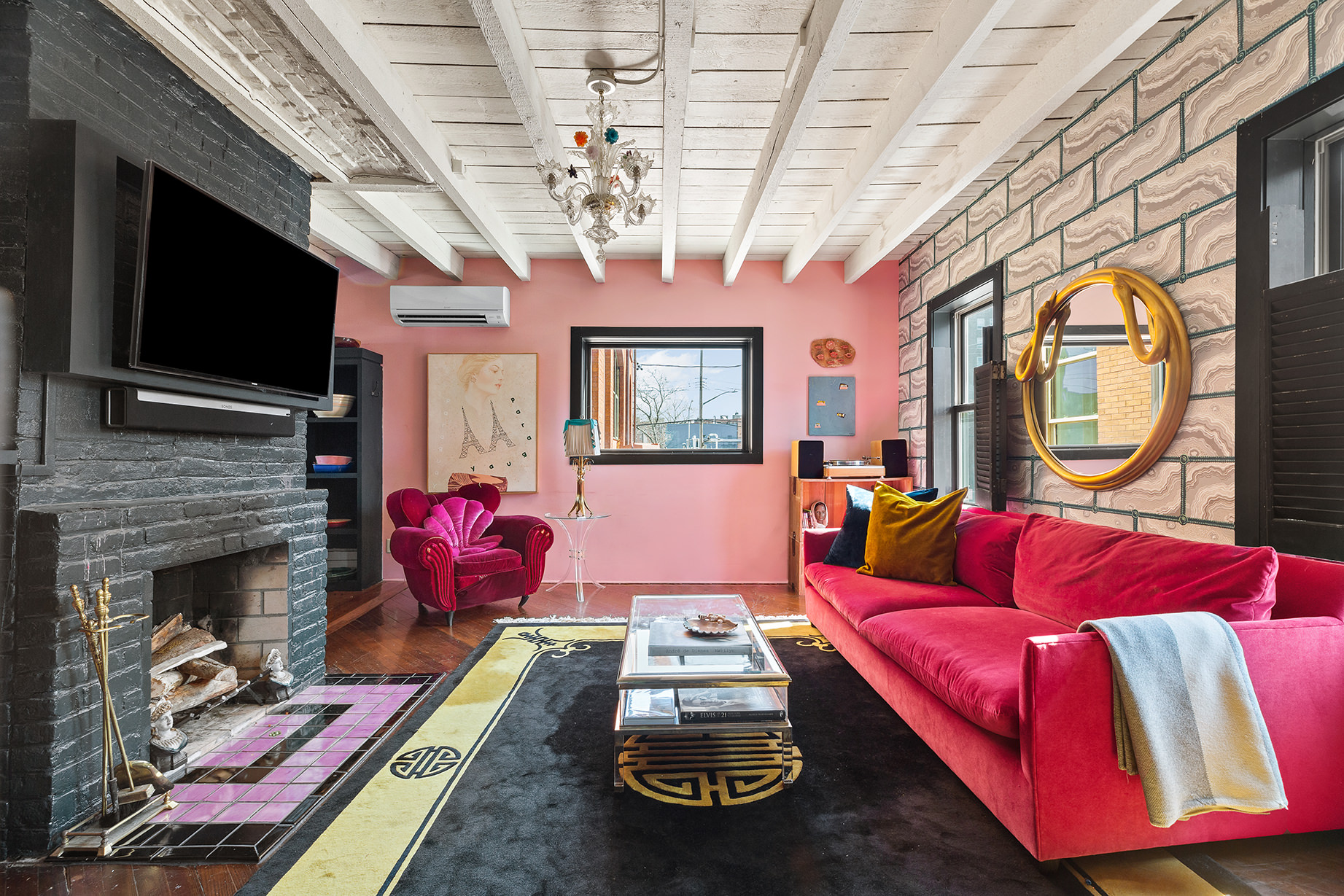 a living room with furniture fireplace and flat screen tv