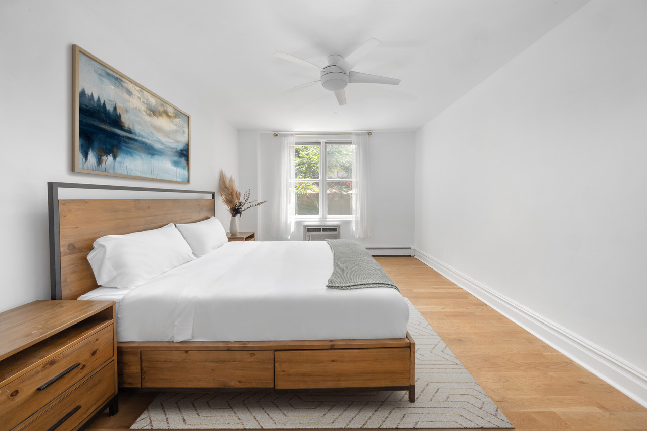 150 South 1st Street, Unit 2K Brooklyn, NY 11211 - Photo 7 of 12 a bedroom with a bed and window