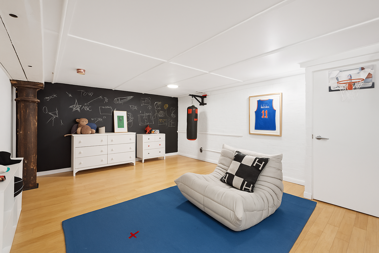 125 Watts Street, Unit 1 Manhattan, NY 10013 - Photo 17 of 24 a living room with furniture and white walls