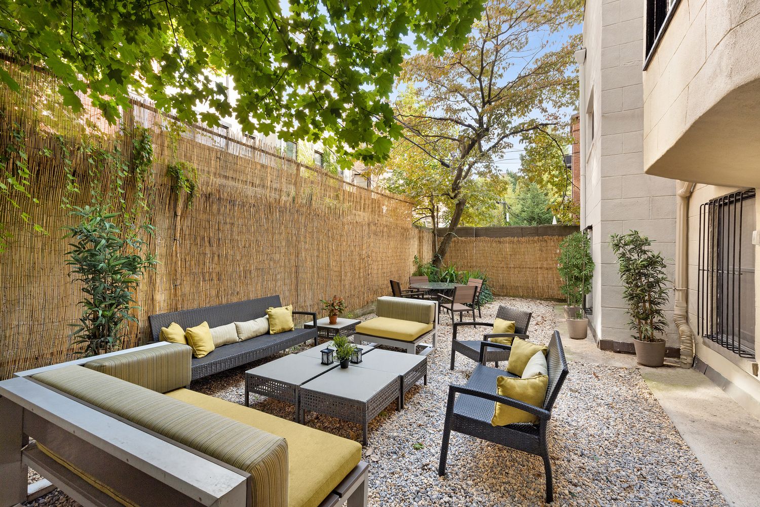 315 Washington Avenue Brooklyn, NY 11205 - Photo 29 of 38 a view of a patio with couches and a table and chairs with wooden fence