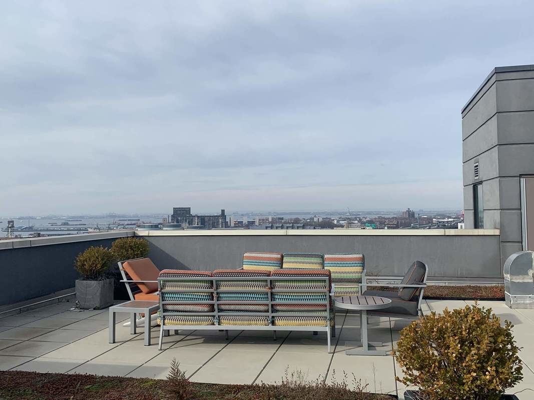 a view of a terrace with sitting area