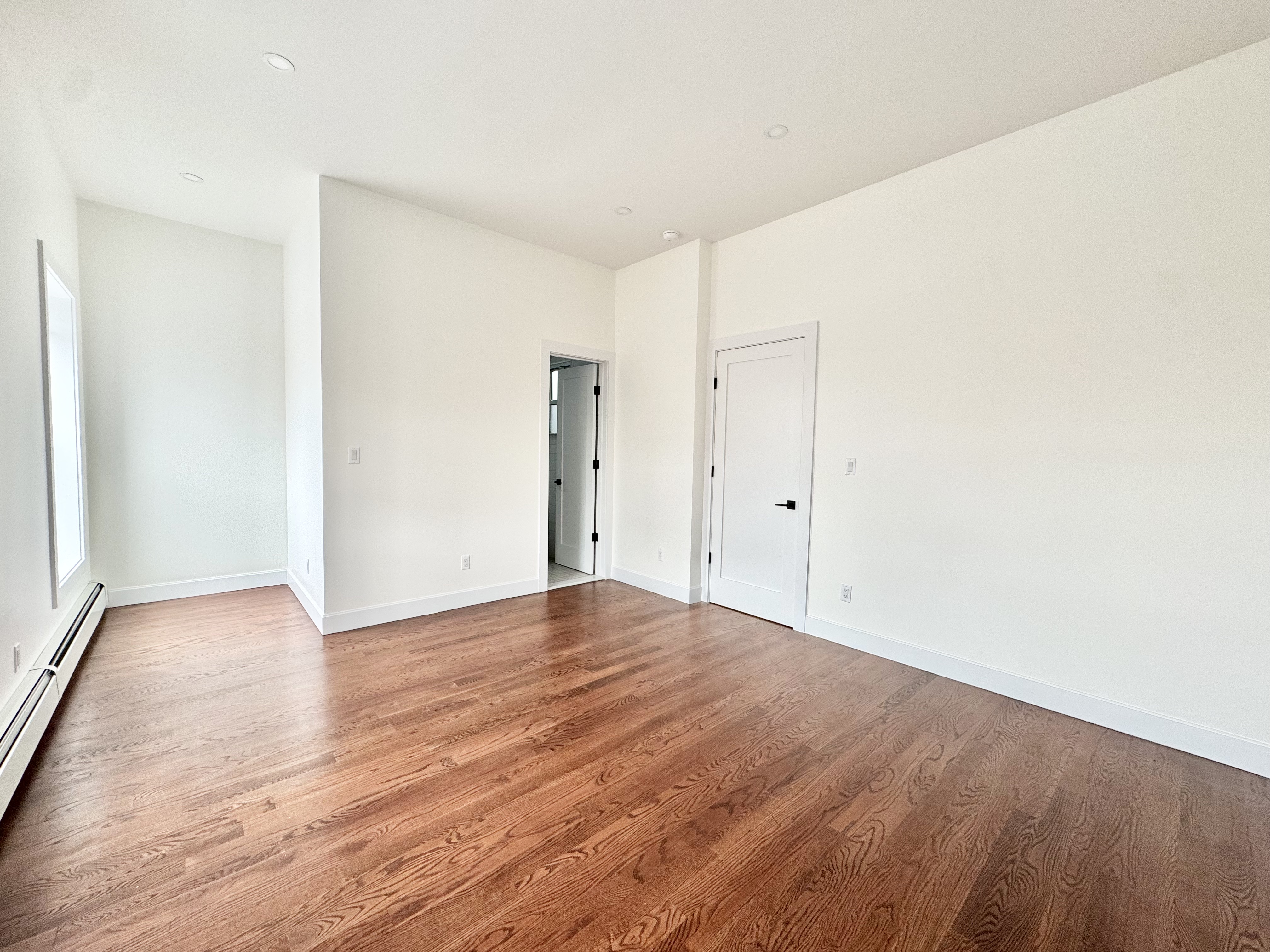 383 Myrtle Avenue, Unit 3 Brooklyn, NY 11205 - Photo 9 of 21 a view of an empty room with wooden floor