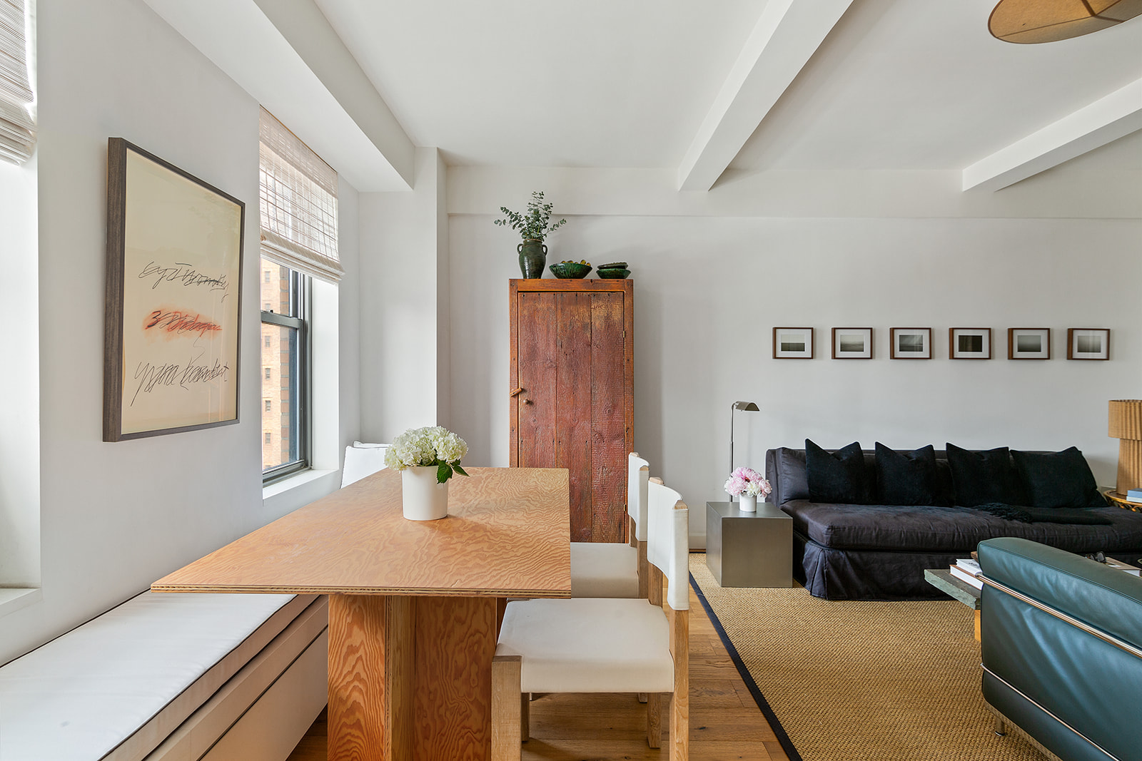 161 West 16th Street, Unit 12D Manhattan, NY 10011 - Photo 2 of 8 a living room with furniture and wooden floor