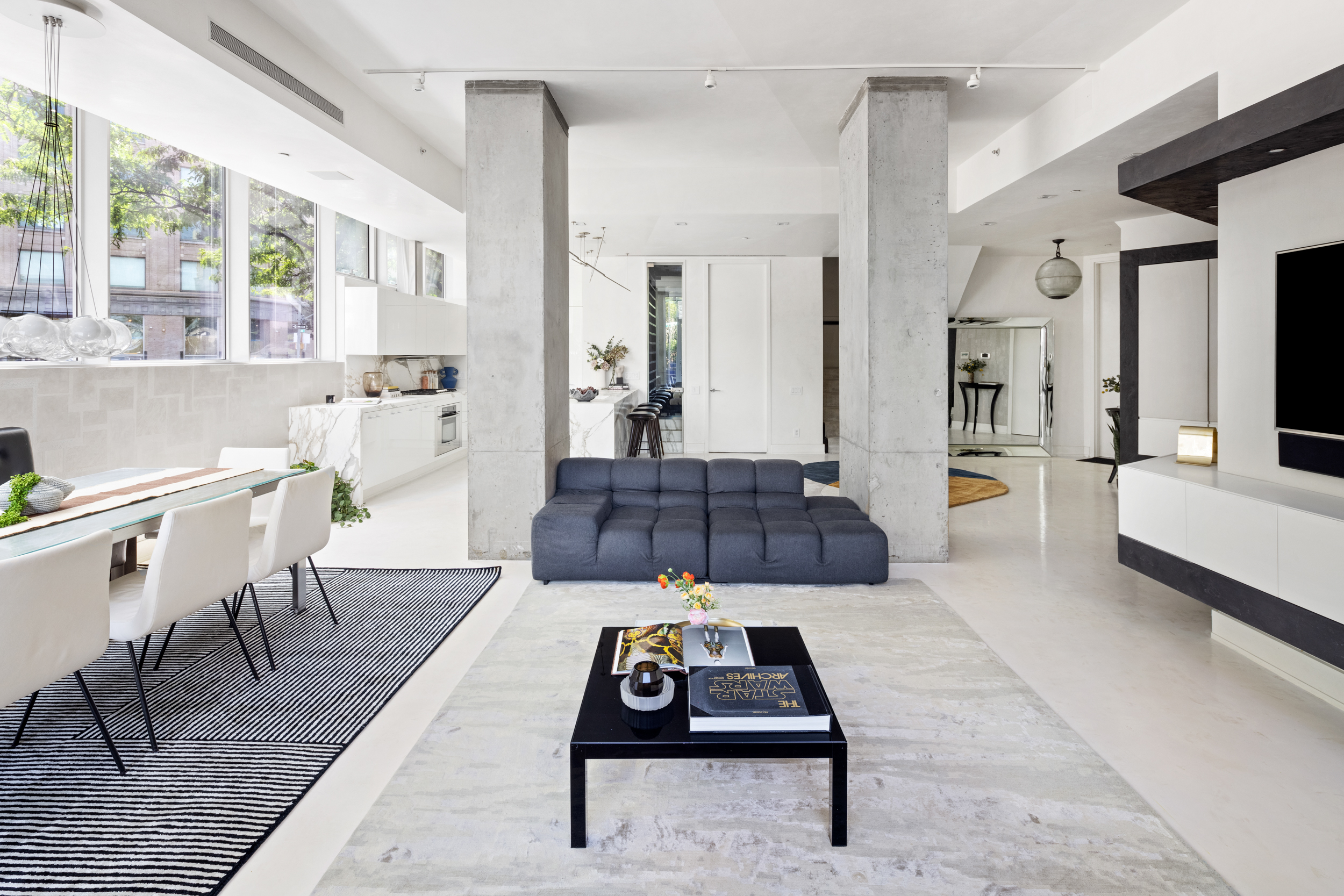 471 Washington Street, Unit 1B Manhattan, NY 10013 - Photo 7 of 17 a living room with furniture and a rug