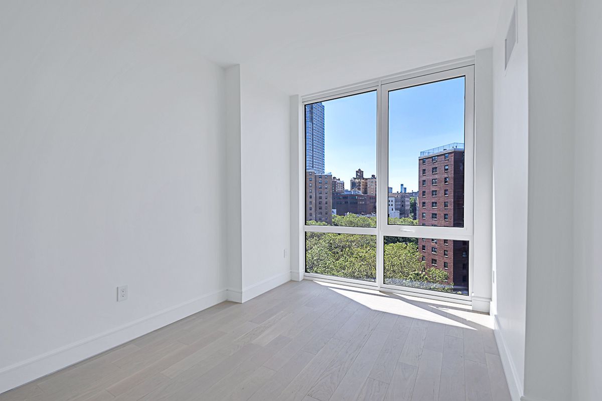 1399 Park Avenue, Unit 7B Manhattan, NY 10029 - Photo 8 of 14 a view of a room with a large window