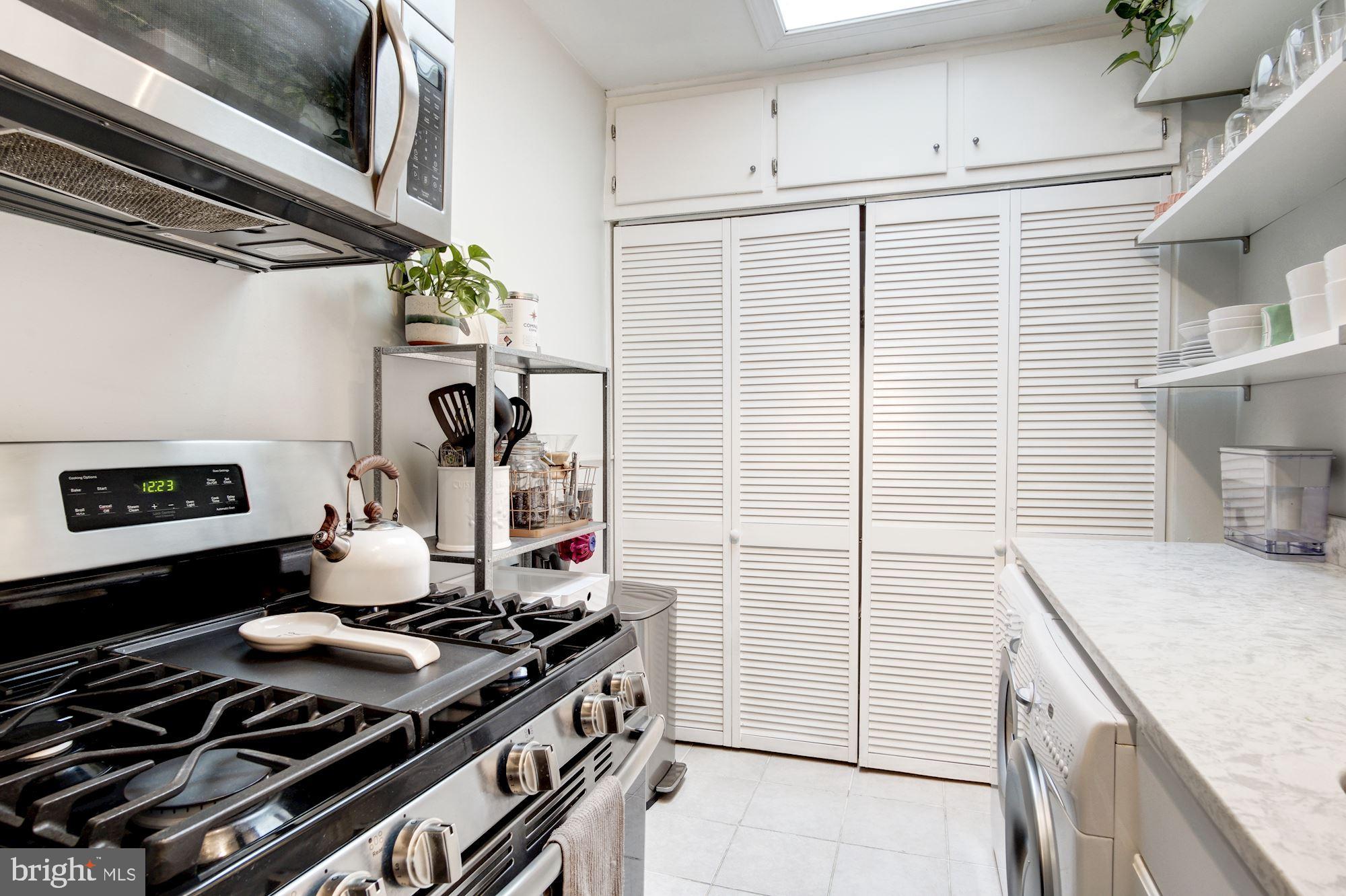 731 13th Street Northeast Washington, DC 20002 - Photo 18 of 43 a kitchen with a stove and a white cabinet