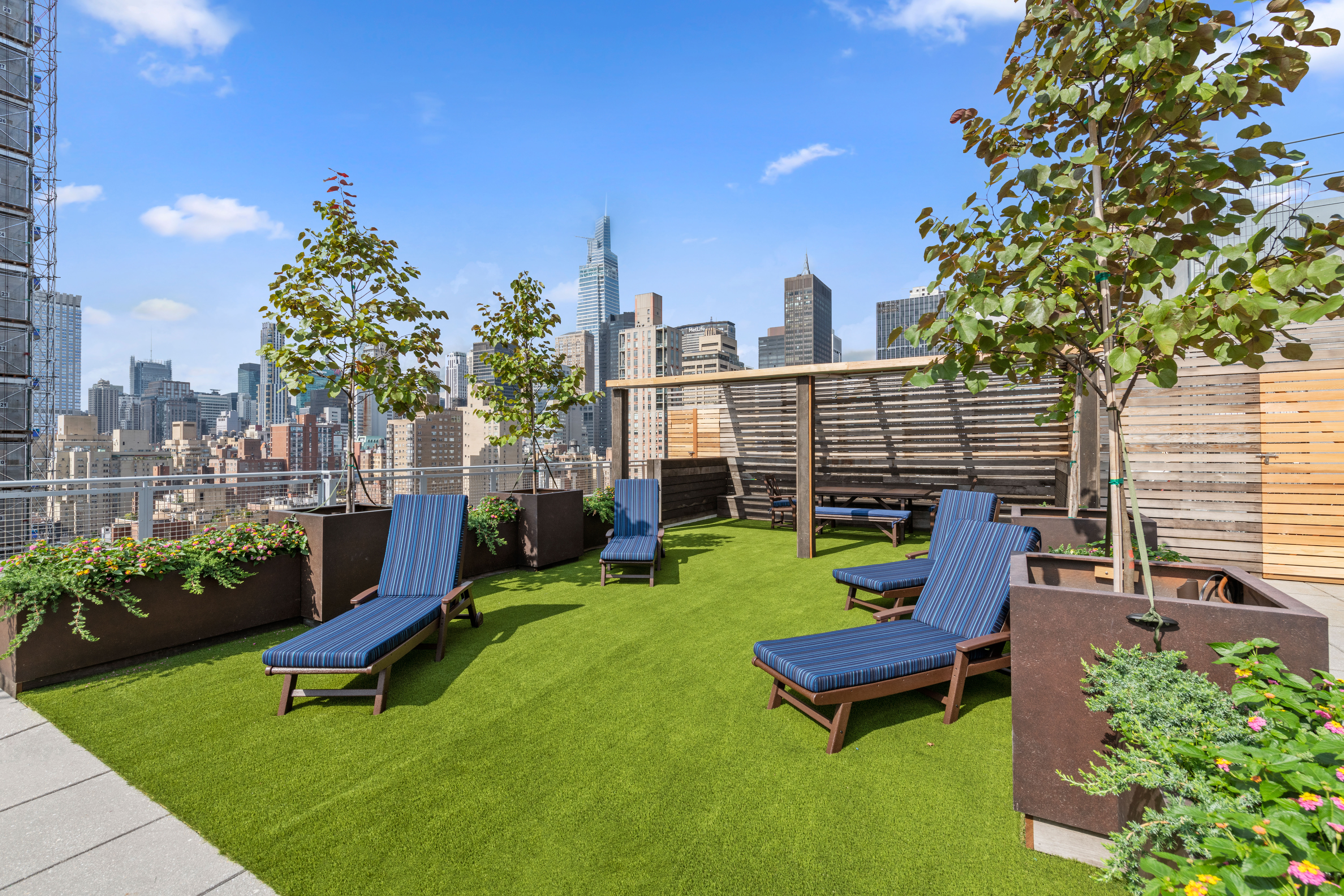 225 East 34th Street, Unit 17C Manhattan, NY 10016 - Photo 14 of 19 a view of a chairs in backyard of the house