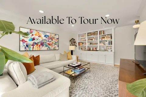 a living room with furniture and rug